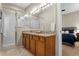 Bathroom features double sinks, granite vanity, and shower at 11522 Fountainhead Dr, Tampa, FL 33626