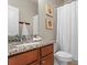 Bathroom with granite countertop and white fixtures at 11522 Fountainhead Dr, Tampa, FL 33626