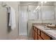 Clean bathroom with shower, double vanity, and granite countertop at 11522 Fountainhead Dr, Tampa, FL 33626