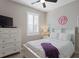Charming bedroom with white dresser and window shutters at 11522 Fountainhead Dr, Tampa, FL 33626