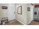 Bright entryway with wood-look floors and a bench at 11522 Fountainhead Dr, Tampa, FL 33626