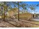 Exterior view of the house with landscaping and trees at 11522 Fountainhead Dr, Tampa, FL 33626