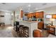 Kitchen with granite counters, wood cabinets, and breakfast bar at 11522 Fountainhead Dr, Tampa, FL 33626