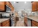 Open kitchen features granite counters and stainless steel appliances at 11522 Fountainhead Dr, Tampa, FL 33626