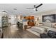 Open living room with kitchen views and hardwood floors at 11522 Fountainhead Dr, Tampa, FL 33626