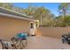 Private patio with table and chairs; lush landscaping at 11522 Fountainhead Dr, Tampa, FL 33626