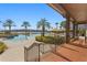 Relaxing resort-style pool with ample lounge chairs and lake views at 11522 Fountainhead Dr, Tampa, FL 33626