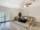 Living area with comfy seating and a large area rug at 11824 Cypress Crest Cir, Tampa, FL 33626