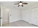 Bedroom with double closets and access to hallway at 11905 Trevino Pl, Tampa, FL 33624