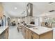 Open concept kitchen island with stainless steel appliances at 11905 Trevino Pl, Tampa, FL 33624