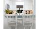 Modern white kitchen with hexagon backsplash and stainless steel appliances at 1429 Pinebrook Dr, Clearwater, FL 33755