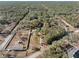 Aerial view showing house, large lot, and surrounding landscape at 14450 Lancer Rd, Spring Hill, FL 34610