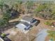 Home's exterior features a covered patio and large backyard at 14450 Lancer Rd, Spring Hill, FL 34610