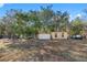 Spacious backyard with shed and other storage buildings at 14450 Lancer Rd, Spring Hill, FL 34610