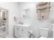 Clean bathroom with white vanity, toilet and shower at 14450 Lancer Rd, Spring Hill, FL 34610
