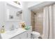 Clean bathroom with white vanity, shower, and toilet at 14450 Lancer Rd, Spring Hill, FL 34610