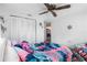 Bedroom with a bed, closet, and access to another room at 14450 Lancer Rd, Spring Hill, FL 34610