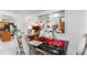 Bright dining room features a large table with seating for six at 14450 Lancer Rd, Spring Hill, FL 34610