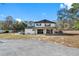 Two-story home with covered porch and large backyard at 14450 Lancer Rd, Spring Hill, FL 34610