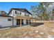 Back of house with covered patio and large yard at 14450 Lancer Rd, Spring Hill, FL 34610