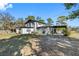 Rear view of house with detached shed and large yard at 14450 Lancer Rd, Spring Hill, FL 34610