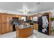 Kitchen with wood cabinets and island at 14450 Lancer Rd, Spring Hill, FL 34610