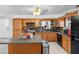 Kitchen with wood cabinets and island at 14450 Lancer Rd, Spring Hill, FL 34610