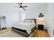 Spacious bedroom with king-size bed and ceiling fan at 14469 Bulger Ave, Port Charlotte, FL 33953