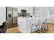 Modern kitchen with white cabinets and stainless steel appliances at 14469 Bulger Ave, Port Charlotte, FL 33953