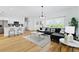 Spacious living room with L-shaped sectional sofa and wood floors at 14469 Bulger Ave, Port Charlotte, FL 33953