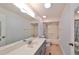 Clean bathroom with shower/tub combo, toilet, and vanity with mirror at 1526 Leland Dr # 1525, Sun City Center, FL 33573