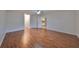 Bright bedroom with hardwood floors and access to hallway at 1526 Leland Dr # 1525, Sun City Center, FL 33573