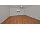 Large bedroom with hardwood floors and a ceiling fan at 1526 Leland Dr # 1525, Sun City Center, FL 33573