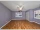 Spacious bedroom with wood floors, ceiling fan, and double closets at 1526 Leland Dr # 1525, Sun City Center, FL 33573