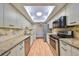 Modern kitchen featuring stainless steel appliances and granite countertops at 1526 Leland Dr # 1525, Sun City Center, FL 33573
