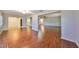 Open concept living room with hardwood floors and views to kitchen at 1526 Leland Dr # 1525, Sun City Center, FL 33573