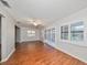 Living room with hardwood floors and sliding glass doors to the patio at 1526 Leland Dr # 1525, Sun City Center, FL 33573