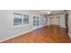 Bright living room with hardwood floors and white plantation shutters at 1526 Leland Dr # 1525, Sun City Center, FL 33573