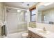 Clean bathroom with a shower/tub combo and vintage wallpaper at 153 Sunward Ave, Palm Harbor, FL 34684