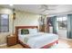 Spacious bedroom with a king-size bed and ceiling fan at 153 Sunward Ave, Palm Harbor, FL 34684