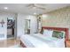 King-size bed, ensuite bathroom, and walk-in closet at 153 Sunward Ave, Palm Harbor, FL 34684