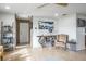 Light-filled entryway with wood flooring and unique console table at 153 Sunward Ave, Palm Harbor, FL 34684