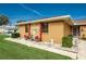 Single story home with stone accents, landscaped yard, and a two car garage at 153 Sunward Ave, Palm Harbor, FL 34684
