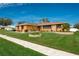 Single story home with stone accents, landscaped yard, and a two car garage at 153 Sunward Ave, Palm Harbor, FL 34684