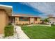 Single story home with stone accents, landscaped yard, and a two car garage at 153 Sunward Ave, Palm Harbor, FL 34684