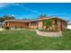 Single story home with stone accents, landscaped yard, and a two car garage at 153 Sunward Ave, Palm Harbor, FL 34684