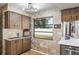 Updated kitchen with wood cabinets and a large window at 153 Sunward Ave, Palm Harbor, FL 34684