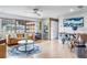 Bright living room with hardwood floors, comfy furniture, and large windows at 153 Sunward Ave, Palm Harbor, FL 34684