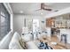 Open living area with white sofas and views of the dining area at 153 Sunward Ave, Palm Harbor, FL 34684