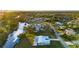 Aerial view of two-story home on waterfront property with canal access at 159 Danforth Dr, Punta Gorda, FL 33980